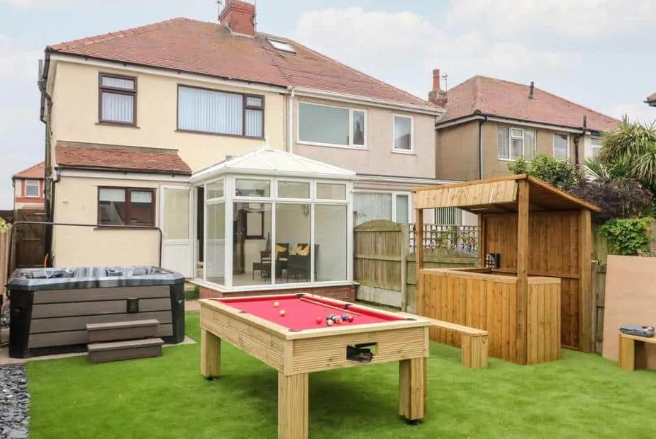 Rear view of 71 Nutter Road with hot tub, conservatory and outdoor pool table.
