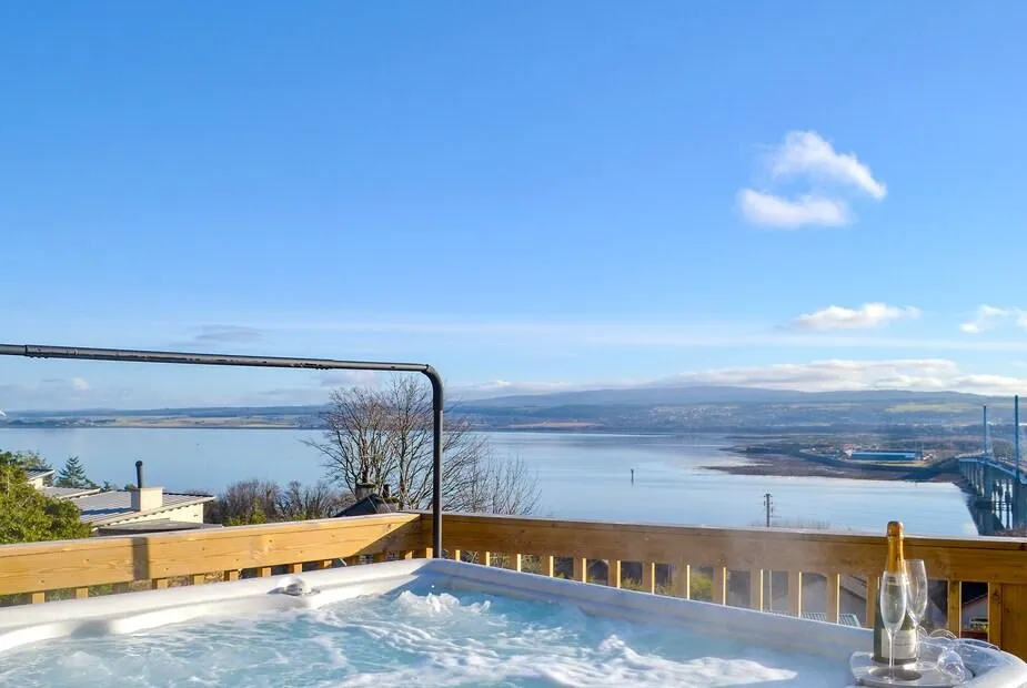 Hot tub on an elevated deck with panoramic views across the Moray Firth and Kessock Bridge