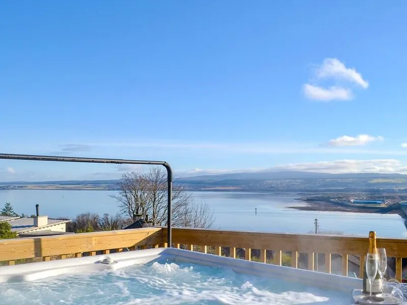 Hot tub on an elevated deck with panoramic views across the Moray Firth and Kessock Bridge