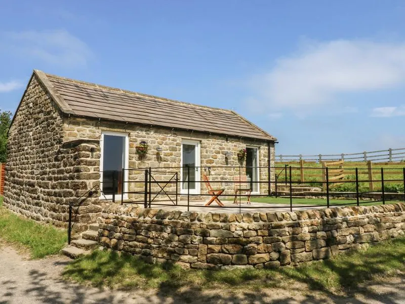 Lake Farm Cottage stone stable conversion with dry stone wall, patio, and Nidderdale countryside