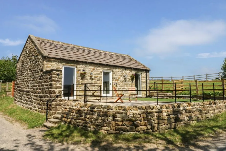 Lake Farm Cottage stone stable conversion with dry stone wall, patio, and Nidderdale countryside