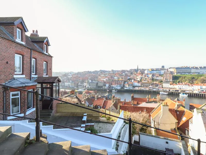 Mariner's Watch red brick villa on the hillside with panoramic views across Whitby harbour and rooftops