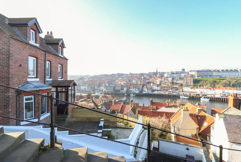 Mariner's Watch red brick villa on the hillside with panoramic views across Whitby harbour and rooftops