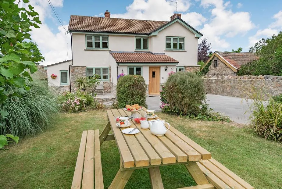 Pennyard House with picnic table and afternoon tea set in the front garden