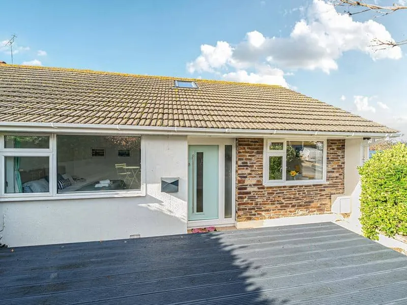 Sunset View cottage exterior with stone detail and front decking area