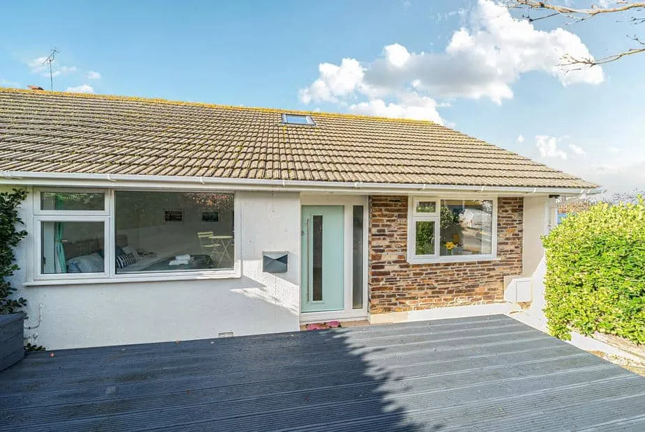 Sunset View cottage exterior with stone detail and front decking area