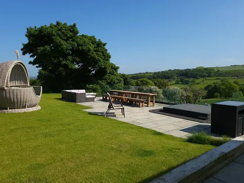 Cottage patio with outdoor seating, hot tub and countryside views
